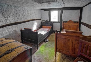 Bedroom of a farm cottage, interior view, open-air museum Klockenhagen, historic Mecklenburg