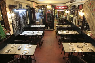 Restaurant dining tables inside famous historic Los Gatos Cervecerias bar, Madrid, Spain, Europe