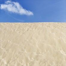 Empty dune, shifting dune, fine sand, spring clouds, minimalist landscape, symbolic image,