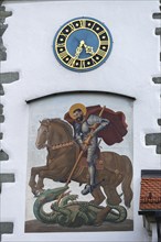 Moated castle, Lake Constance, parish church of St George, church tower clock, church patron saint