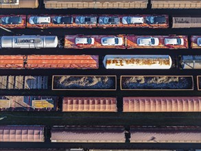 Deutsche Bahn AG marshalling yard. Many goods trains are parked on the tracks with tank wagons, car