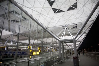 Architectural detail illuminated by lights at night, Stansted airport, Essex, England, United