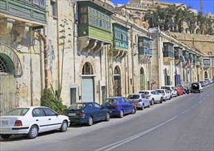 Historic waterfront buildings on Grand Harbour waterside, Valletta, Malta, Europe