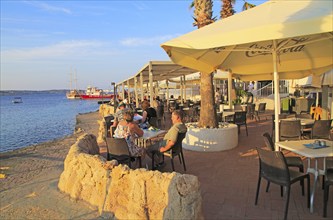 Waterfront cafe restaurant Mellieha Bay resort, Marfa peninsula, Malta, Europe