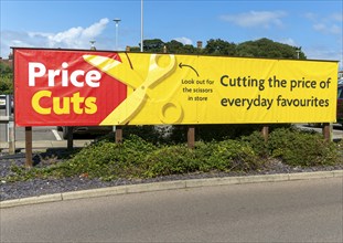 Price Cuts advertising banner sign, Morrisons supermarket, Cromer, north Norfolk, England, UK