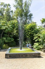 Exotic garden with fountain sculpture by Gile Raynor, East Ruston Old Vicarage garden, East Ruston,