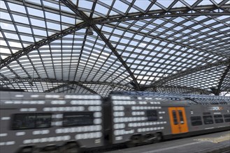 Local train and glass roof at Cologne Central Station, Cologne, Rhineland, North Rhine-Westphalia,