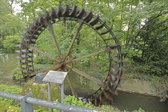 Water wheel of the historic colour mill, mill wheel, paddle wheel, motion blur, blur, old town,