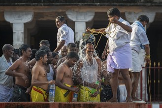 Pilgrims at a washing ritual with 22 stations around the Ramanathaswami temple, a ceremony in which