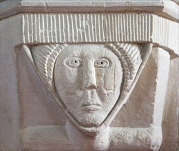 Stonework carved head of woman, church of Saint Michael, Yanworth, Gloucestershire, England, UK