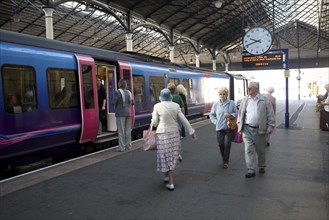 Train and passengers on platform of Scarborough railway station, Yorkshire, England, United