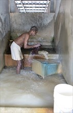 Indian man, 63 years old, washing clothes at the Dhoby Khana laundry, Kochi, Kerala, India, Asia