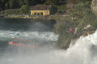 Rhine Falls seen from Schloss Laufen, tourist boat, rapids, spray, Canton Zurich, on Neuhausen,