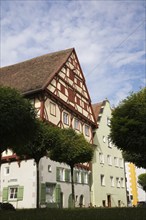 Multi storied apartment buildings with traditional terracotta ceramic tiled rooftops in medieval