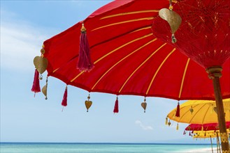 Traditional Balinese temple sunshade as parasol, Hinduism, symbol, beach holiday, protection, sun