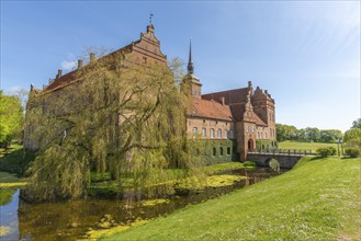 Holckenhavn Castle, hotel, brick building, castle church, castle moat, bridge, entrance gate, park,