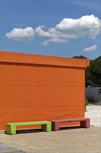 Orange painted house and light green bench, ticket counter, Paleo Falliro, Athens, Attica, Greece,