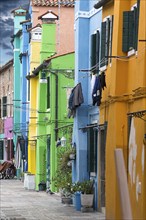 Colourful houses in an alley, Burano, Veneto, Italy, Europe