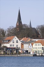 Town view at Lake Malchow with town harbour and town church, Malchow, island town, Mecklenburg Lake