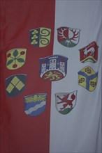 City flag and city districts, city coat of arms with lion figure and three towers, red, white,