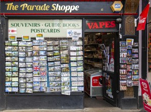 Postcards on display outside The Parade Shopper souvenir shop store in city centre, Cambridge,