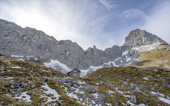 Lamsenjochhütte in autumn, rocky summit of the Lamsenspitze behind, Karwendel, Tyrol, Austria,