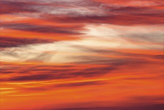 Orange-red coloured cloudy sky after sunset, cloud formation, evening sky, sunset,