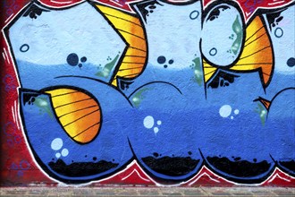 Detailed graffiti in blue and orange with vivid colour elements on a wall, Landau,