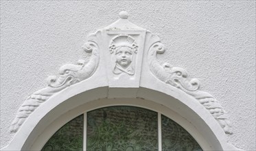 Relief of a girl's head above the fenaster of the oldest kindergarten in Lauf, 1850, Alter Schulhof