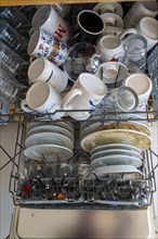 Dishwasher, full of dirty crockery