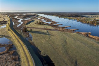 Aerial view of new dyke construction further inlands than the old dyke, flood protection, river