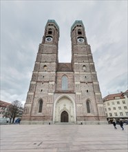 The Church of Our Lady in Munich with its striking Gothic brick towers under a cloudy sky, Church