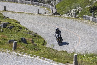 Motorcyclists on the road on La Tremola, the world-famous Alpine pass through the Val Tremolo,