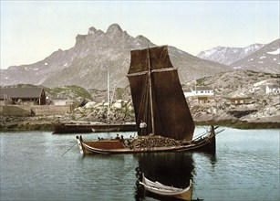 Print shows a Nordlandsbåt ship, outside of the town of Svolvær in the Lofoten district, Nordland