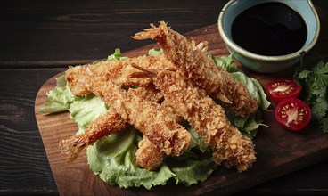 Fried shrimp, peeled in tempura, soy sauce, close-up