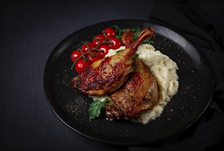 Fried duck shank, cauliflower puree, cherry tomatoes, homemade, no people