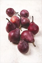 Red pears scattered on the table, barletta pear, selective focus, no people