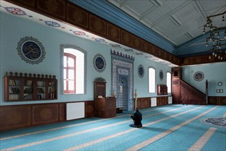 Man praying in the Fethiye Mosque, former Russian Orthodox Church, Interior, Kars, Turkey, Asia