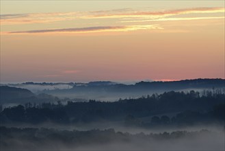 Sunrise, fog rising over the Arnsberg Forest nature park Park, North Rhine-Westphalia, Germany,