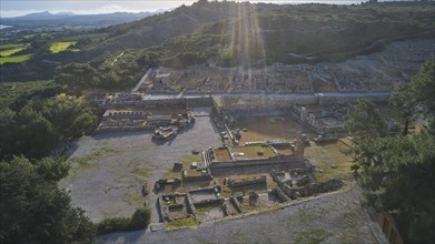 Drone shot, first morning light, backlight, sun rays, Ancient ruins of an archaeological site