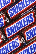 Snickers bar chocolate bar from Mars Inc. as background