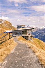 Field path leads to an elevated mountain station with a view, Planplatten, Switzerland, Europe