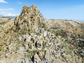 Mountains and Olive groves around Ghost Town from a drone, Pentedattilo Village, Calabria, Italy,