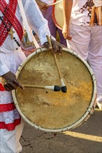 Drum player during a religious festival of Afro-Brazilian culture on the streets of Brazil, Belo