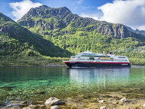 Hurtigruten cruise ship passing the Raftsund, the strait between islands Hinnøya and Austvågøya,