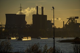 Sunset, cargo ships on the Rhine, steelworks, Hüttenwerke Krupp Mannesmann, cooling towers of the