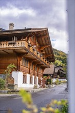 A traditional wooden chalet in a mountain village in autumn, Lake Brienz, Brienz, Switzerland,