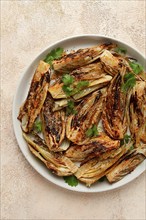 Baked, oven-baked fennel, with spices, in olive oil, homemade, no people