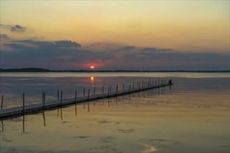 Sunset on a jetty in the Limfjord near Hvalpsund, Denmark, Europe