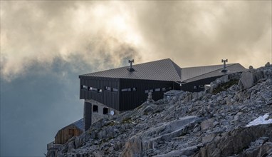 Mountain hut Refuge Albert 1er, high alpine mountain landscape at sunset, Glacier du Tour,